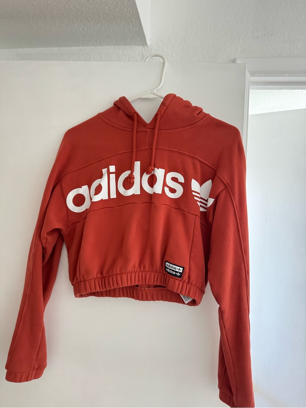 adidas Women's orange Cropped Hoodie Sweater